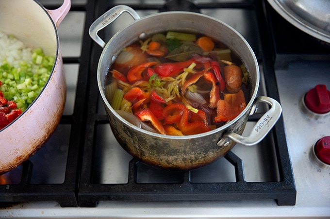 Vegetable stock in a pot on the stovetop.